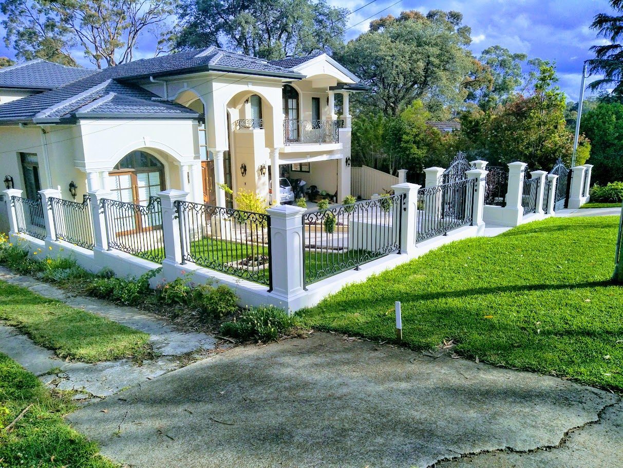 Cast stone piers with wrought iron gates and infills, North Shore